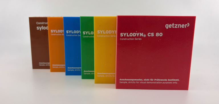 Multiple colourful Sylodyn CS samples in various colours, stacked and arranged diagonally in a row. Multiple colourful Sylodyn CS samples in various colours, stacked and arranged diagonally in a row.
