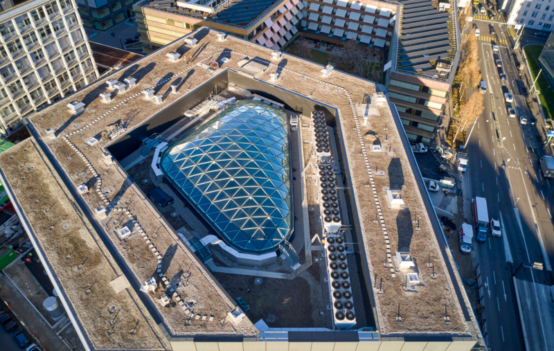 Building roof with skylight and ventilation systems, ideal for vibration isolation.